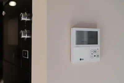 a microwave on a wall next to a door at City Luxury Apartment, Downtown Porto near Metro in Porto