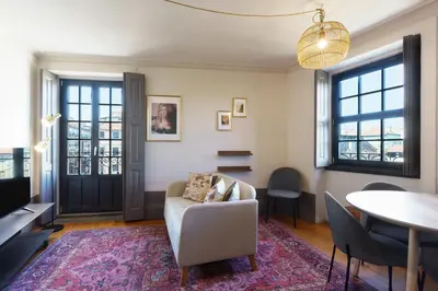 a living room with a couch and a table at Feel Porto Antique Poveiros Flats in Porto