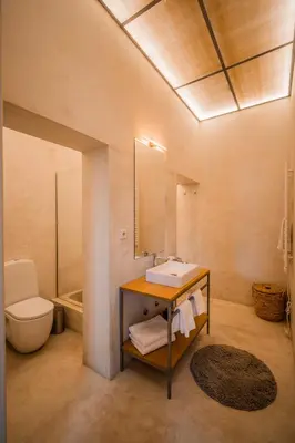a bathroom with a sink and a toilet at Paraíso Garden Suite--- Spacious & Downtown in Porto