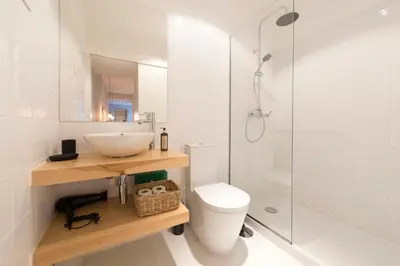 a room with a table and a desk with a tv at Porto Central Loft I with Terrace in Porto