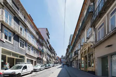 a bedroom with a desk with a lamp and a bed at Porto Central Loft II in Porto