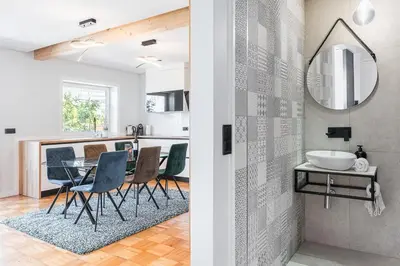 a kitchen and dining room with a table and chairs at GuestReady - Urban Retreat in Gaia in Vila Nova de Gaia