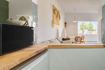 a living room with a flat screen tv on a counter at Santa Catarina Panoramic Loft in Porto