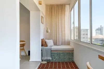 a window seat in a bathroom with a view of the city at Santa Catarina Panoramic Loft in Porto
