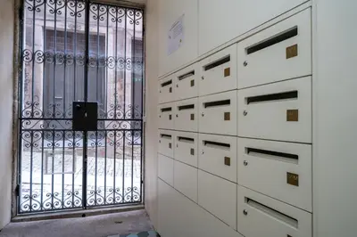 a room with drawers and a door with a window at Mercadores Apartment by Amber Star Rent in Porto