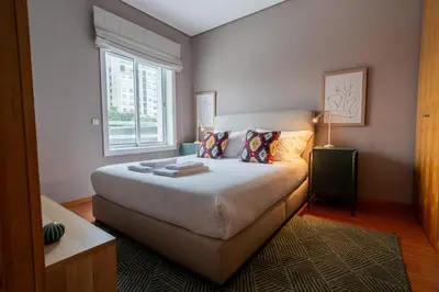 a bedroom with a bed and a window at Taupe Studio perto do Metro - Cedofeita, Porto in Porto
