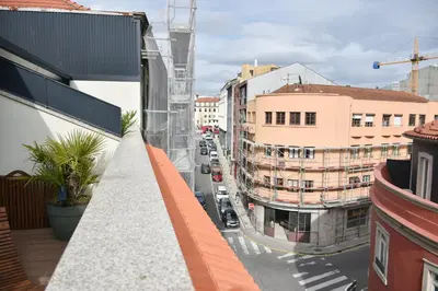 a view of a city street from a balcony at Charmosa penthouse 2 quartos - Batalha - Porto - APT N in Porto