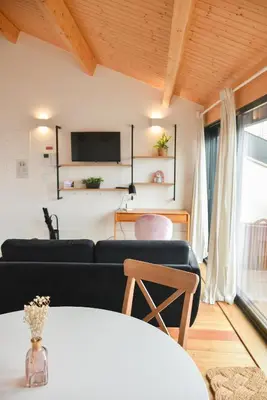 a living room with a couch and a table at Charmosa penthouse 2 quartos - Batalha - Porto - APT N in Porto