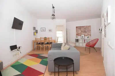 a living room with a couch and a table at Travel & Live Marques in Porto
