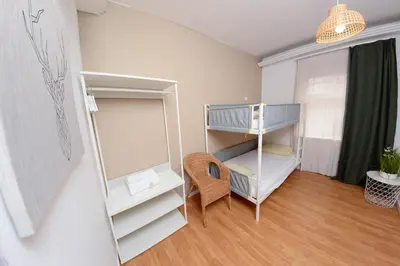 a small room with a bunk bed and a crib at Travel & Live Nature in Porto
