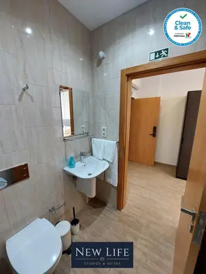 a bathroom with a white toilet and a sink at New Life - CASA MÚSICA SUITE-2F in Porto