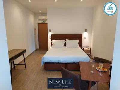 a new life hotel room with a bed and a table at New Life - IGREJA SÃO FRANCISCO STUDIO-2T in Porto