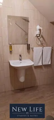 a new life bathroom with a sink and towels at New Life - FUNDAÇÃO SERRALVES STUDIO-0F in Porto