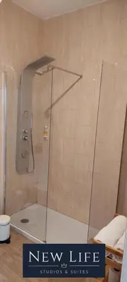 a shower with a glass door in a bathroom at New Life - FUNDAÇÃO SERRALVES STUDIO-0F in Porto