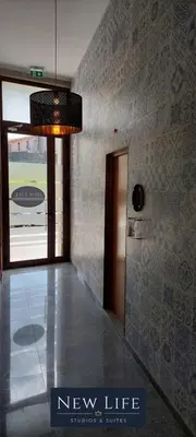 a lobby with a new life sign on the wall at New Life - FUNDAÇÃO SERRALVES STUDIO-0F in Porto
