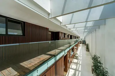 an empty hallway of a building with a glass ceiling at Art Douro Historic Distillery in Vila Nova de Gaia