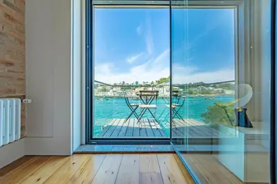 an empty white room with a large window at Art Douro Historic Distillery in Vila Nova de Gaia