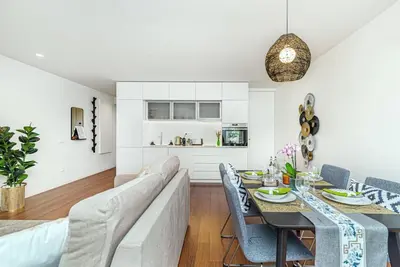 a living room with a couch and a table at Luxury in the Art District by Innkeeper in Porto