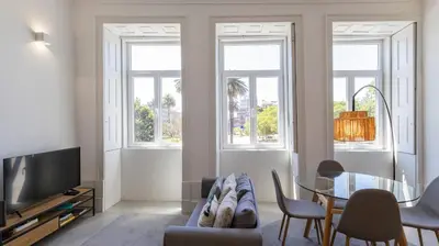 a living room with a couch and a table at OPOrto Downtown Studio by LovelyStay in Porto