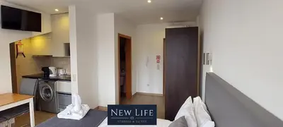 a living room with a new life sign in a kitchen at New Life - PALÁCIO CRISTAL STUDIO-3F in Porto