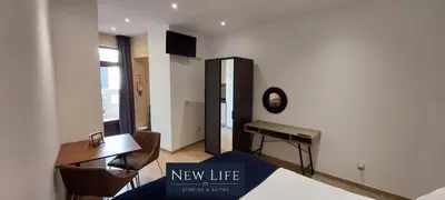a living room with a new life sign on the wall at New Life - PARQUE CIDADE STUDIO-0T in Porto