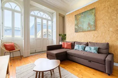 a living room with a couch and a table at GuestReady - Bolhão Market Place in Porto