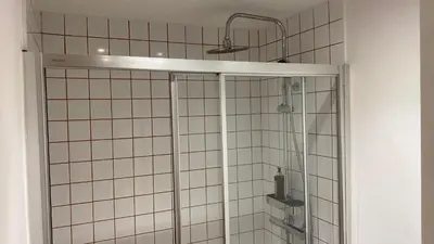 a shower with a glass door in a bathroom at BEST - Studio Porto Downtown with AC and Parking in Porto