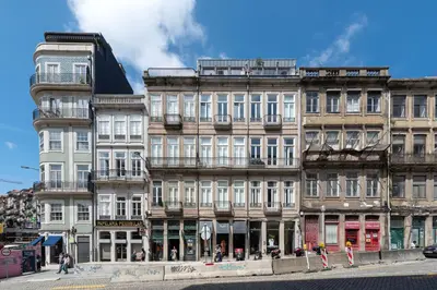 a row of tall buildings on a city street at The Mouzinho Penthouse in Porto