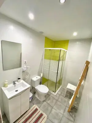 a bathroom with a toilet and a sink and a shower at Douro sunset lounge in Porto