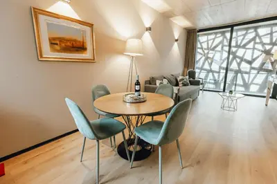 a light in a wall with a box with the word love at City Center Premium Apartment by Vacationy in Porto
