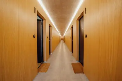 a hallway with wooden doors and a long corridor at Amazing Pool Apartments by Vacationy in Vila Nova de Gaia