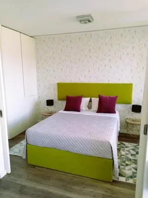 a kitchen and living room with a table and chairs at Hey Porto Apartment in Porto