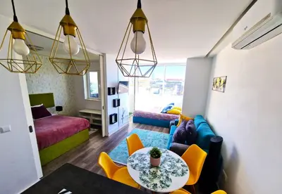 a living room with a table and a couch at Hey Porto Apartment in Porto