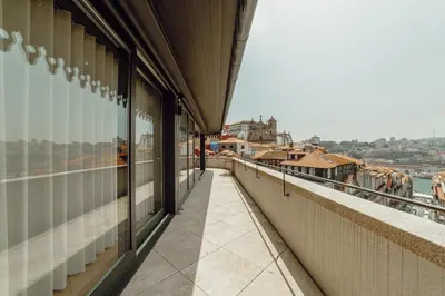 a view from the balcony of a building at Downtown Penthouse With River View by Vacationy in Porto