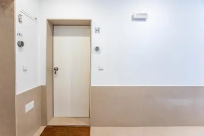 a door in a room with a white wall at Downtown Wonder Flat w/ AC by LovelyStay in Porto