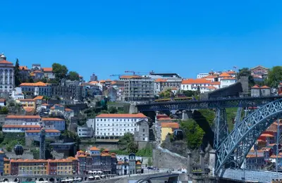 a view of a city with a bridge at 180º Porto River View in Vila Nova de Gaia