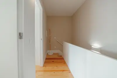 a hallway with a stairway leading to a room at Boavista Premium Apartments by Vacationy in Porto