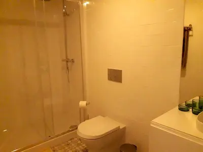 a bathroom with a shower and a toilet and a sink at Porto Vista by Flat in Porto in Porto