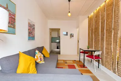 a living room with a couch and a table at Oporto Blue Vitória - Lovely Citycenter Studio in Porto