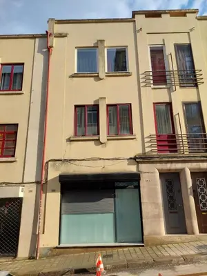 an apartment building with a garage in front of it at charming loft in Porto in Porto