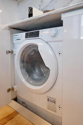 a washer and dryer in a room at Away to Enjoy Apartment - hapiness has a place in Porto