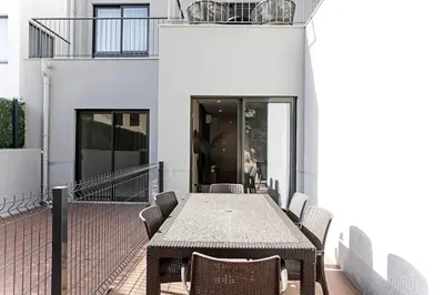 a patio with a table and chairs on a balcony at Paraíso -1B w/ AC & Patio by LovelyStay in Porto