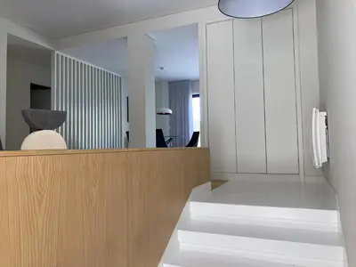 an office with a reception desk and a mirror at Casa do Ofício Galerista in Porto