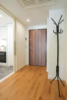 a room with a wooden door and a tripod at HM - Casa Ghiselini Porto 213 in Porto