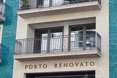 a building with a balcony with the words portal renunciona at HM - Casa Ghiselini Porto 215 in Porto