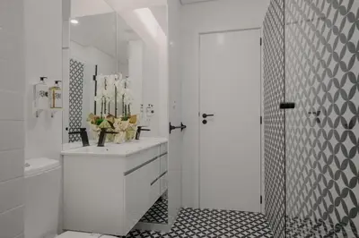 a white bathroom with a sink and a shower at Green Garden Luxury House w/ AC, Metro & Downtown in Porto