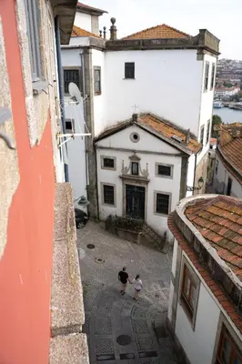 a bedroom with two towels on a bed with a window at Authentic Porto House in Porto
