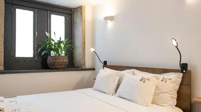 a hallway with a door and a mirror at Authentic Porto House in Porto