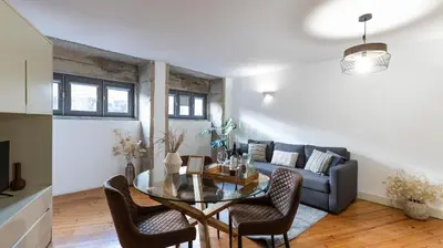 a living room with a couch and a glass table at Authentic Porto House in Porto