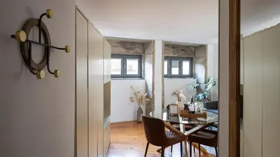 a dining room with a glass table and chairs at Authentic Porto House in Porto